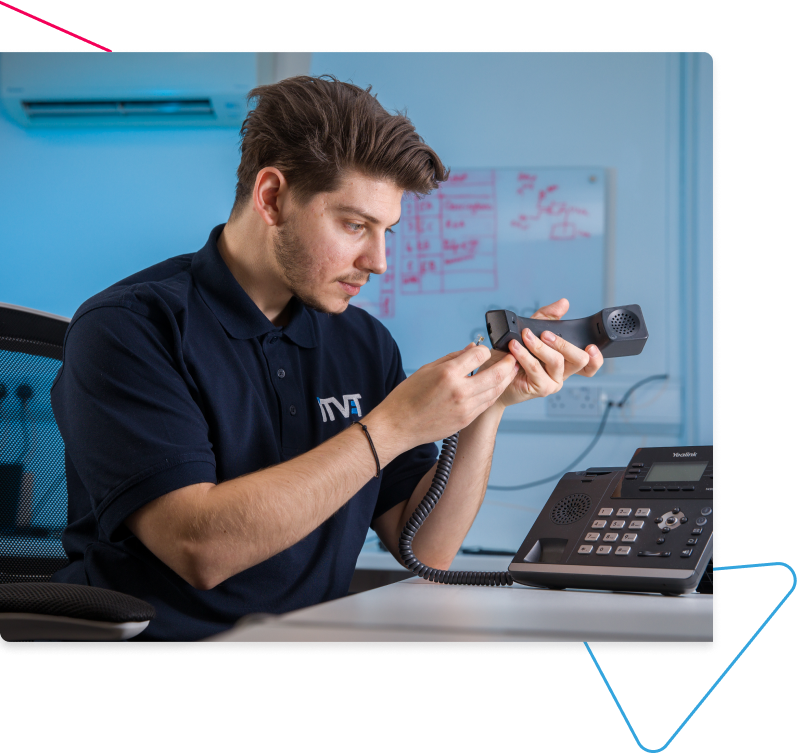 ITVET teammate fixing a phone.