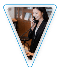 A woman using a telephone handset.