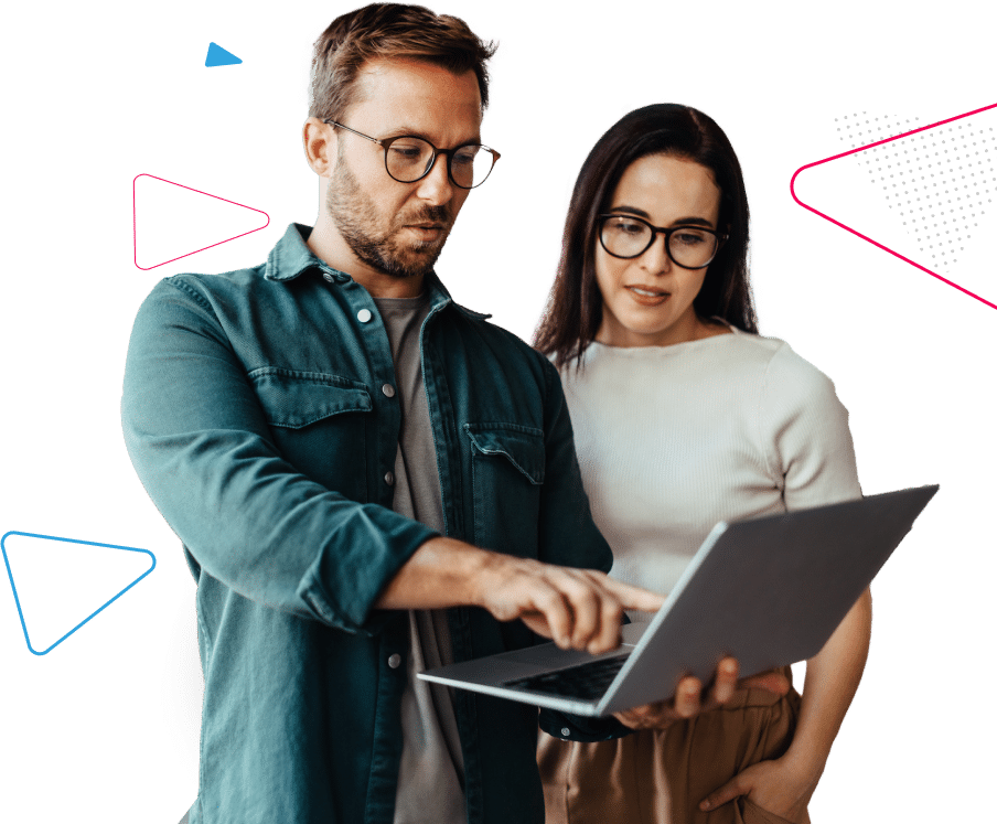 A man and woman looking at a laptop screen.
