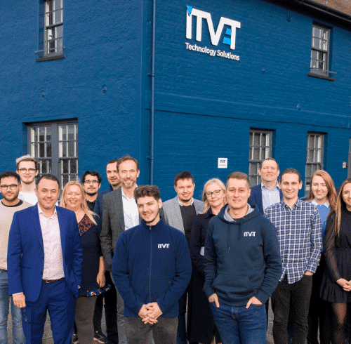 The ITVET team standing outside head office.l