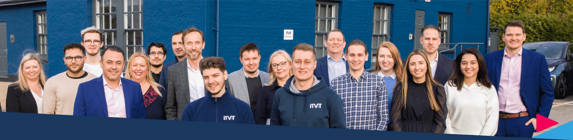 The ITVET team standing outside the head office.