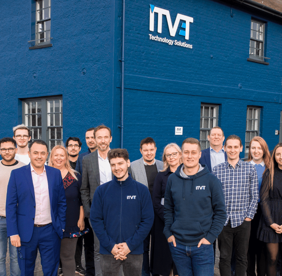 The ITVET team standing outside the head office.