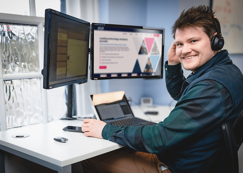 ITVET teammate working at his computer.