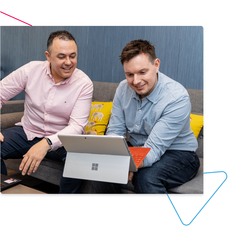 ITVET's Daryl and Paul looking at a laptop.