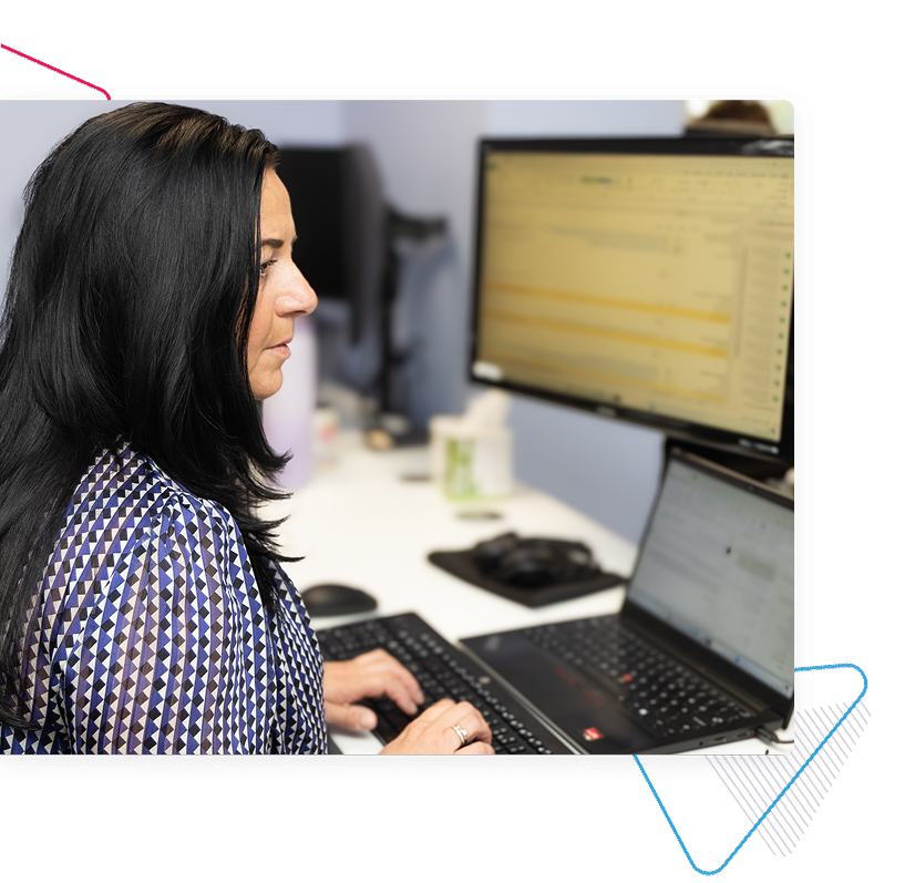ITVET employee working on a computer